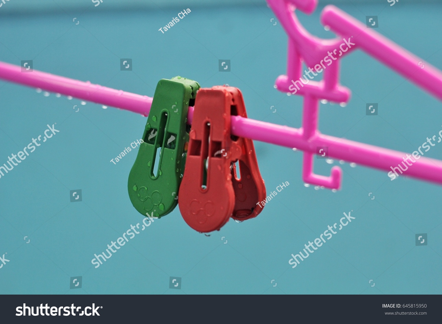 Two Little Clothes Pins on a Clothes Hanger